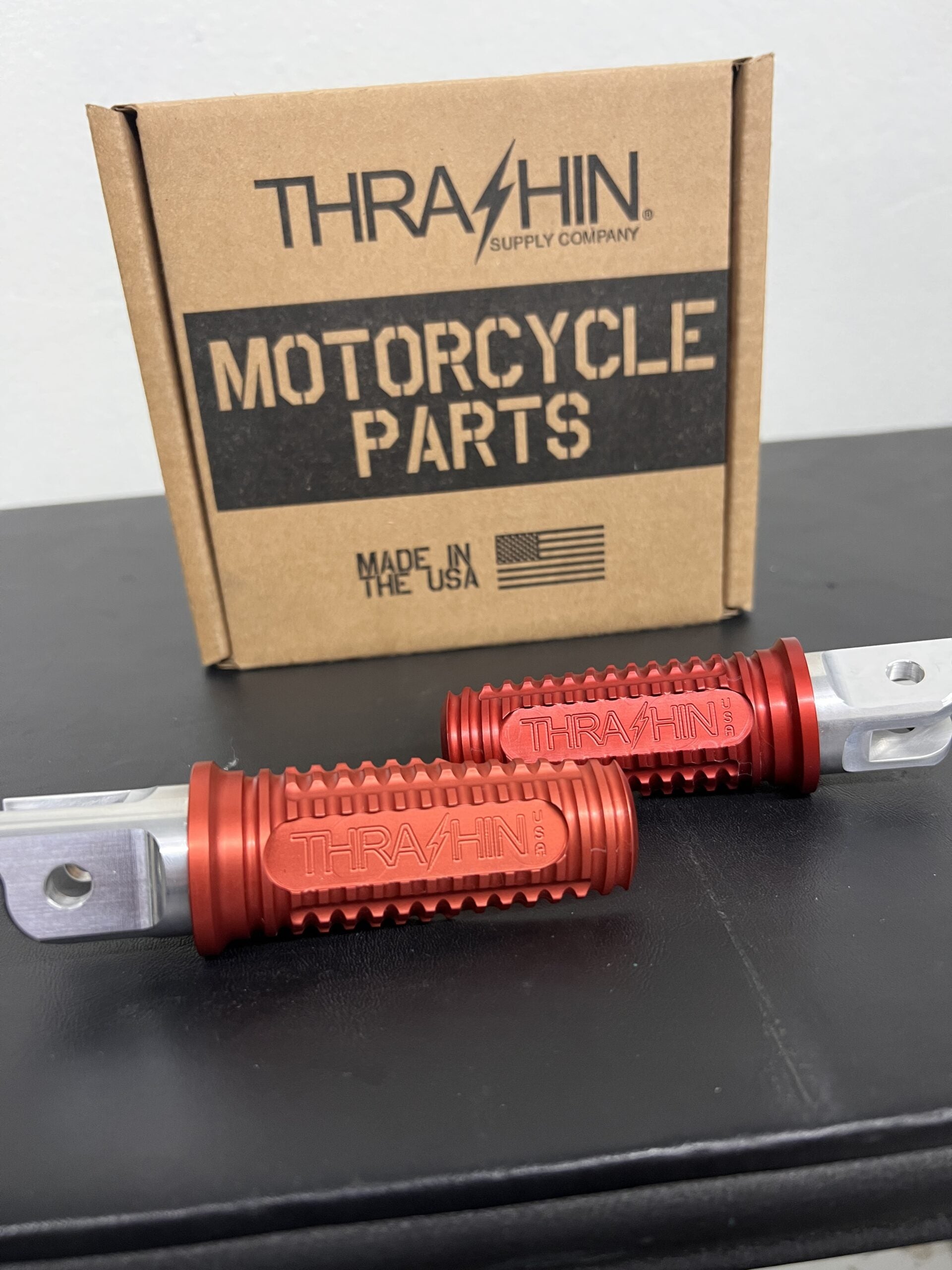 Thrashin Supply Burnout Footpegs for M8 Softail (front) in Red