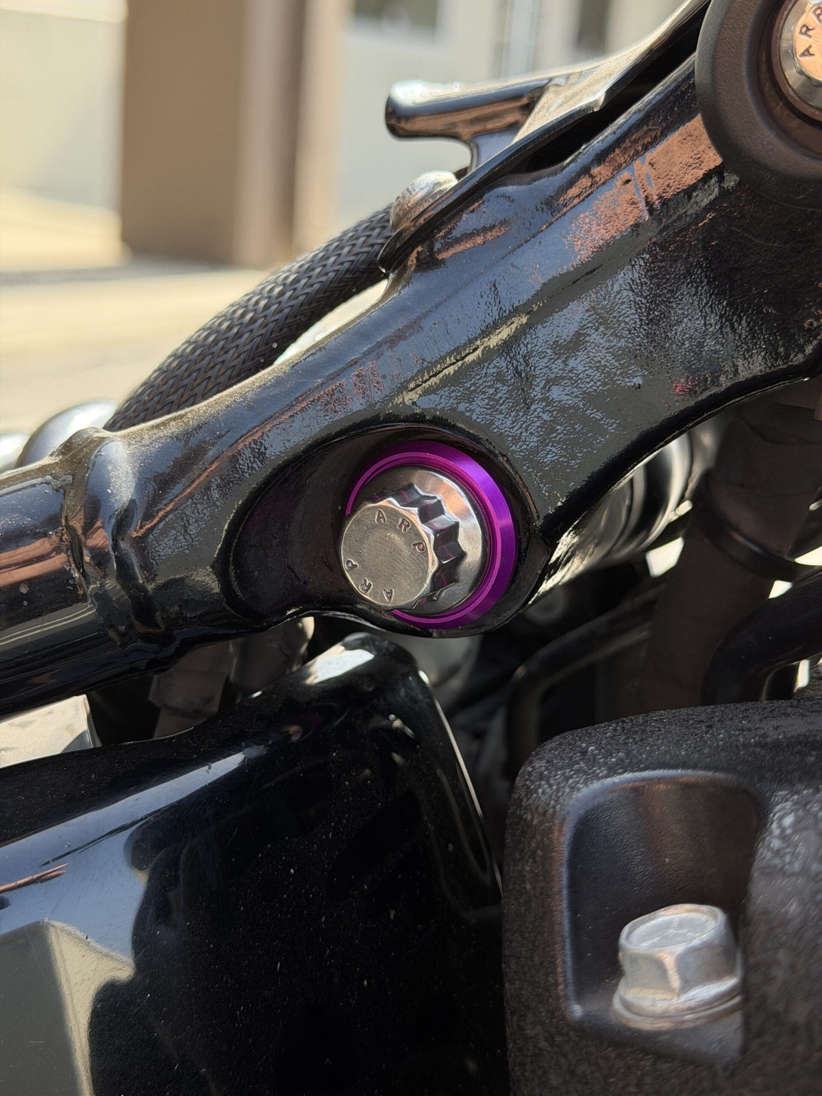 ARP upper shock bolt with spacer washer and billet aluminum accent washer