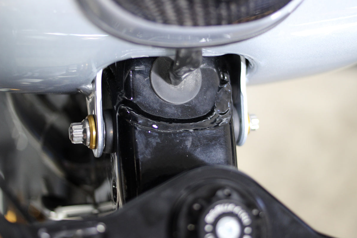 ARP gas tank mounting hardware installed on compatible Harley M8 Softail