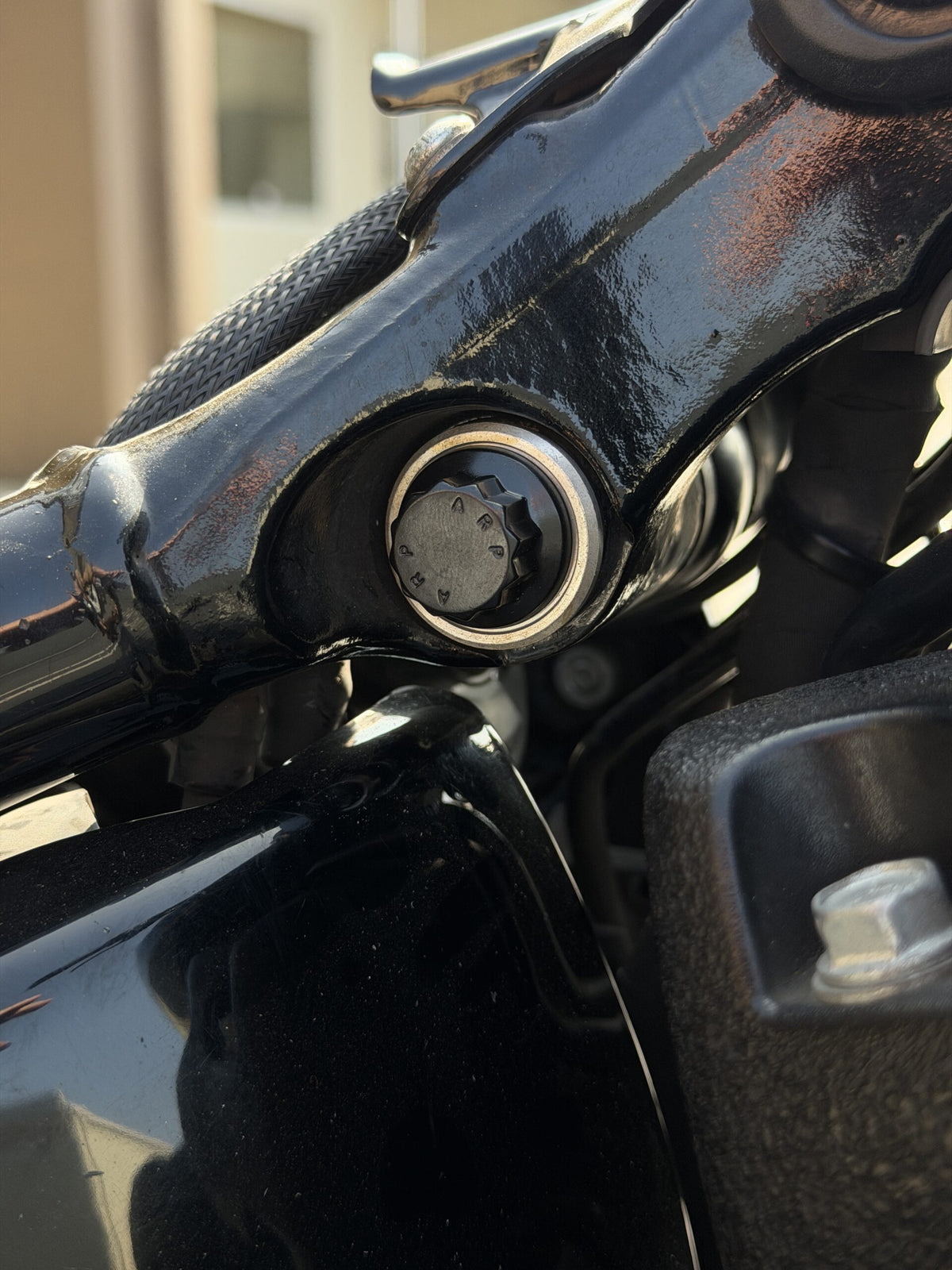 Close-up of ARP 12-point upper shock mounting hardware