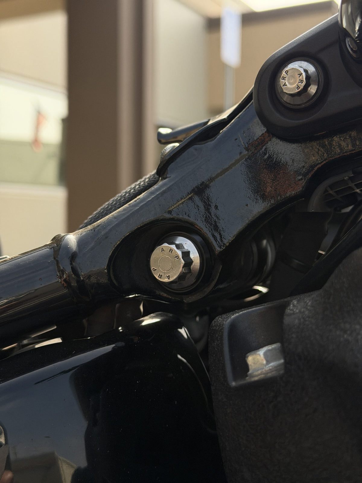 ARP upper shock mounting bolt installed on compatible Harley Milwaukee-Eight Softail