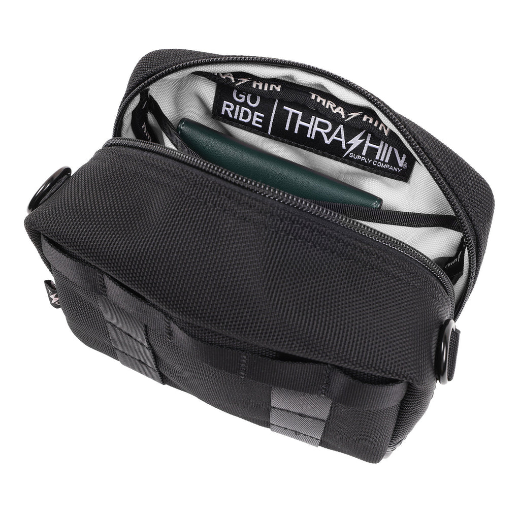 Thrashin Supply crossbody handlebar bag mounted on Harley risers