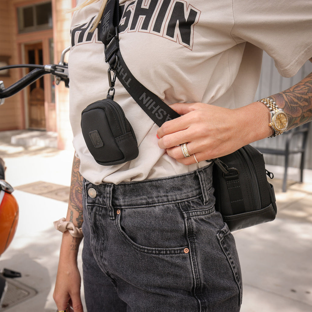 Thrashin Supply crossbody handlebar bag mounted on Harley risers