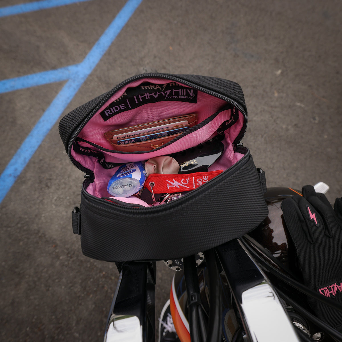 Thrashin Supply crossbody handlebar bag mounted on Harley risers