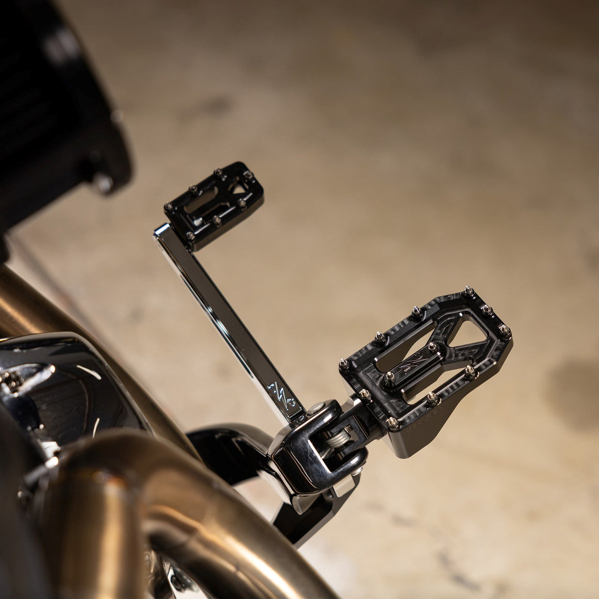 THRASHIN Supply Aggressor billet aluminum Harley footpegs installed