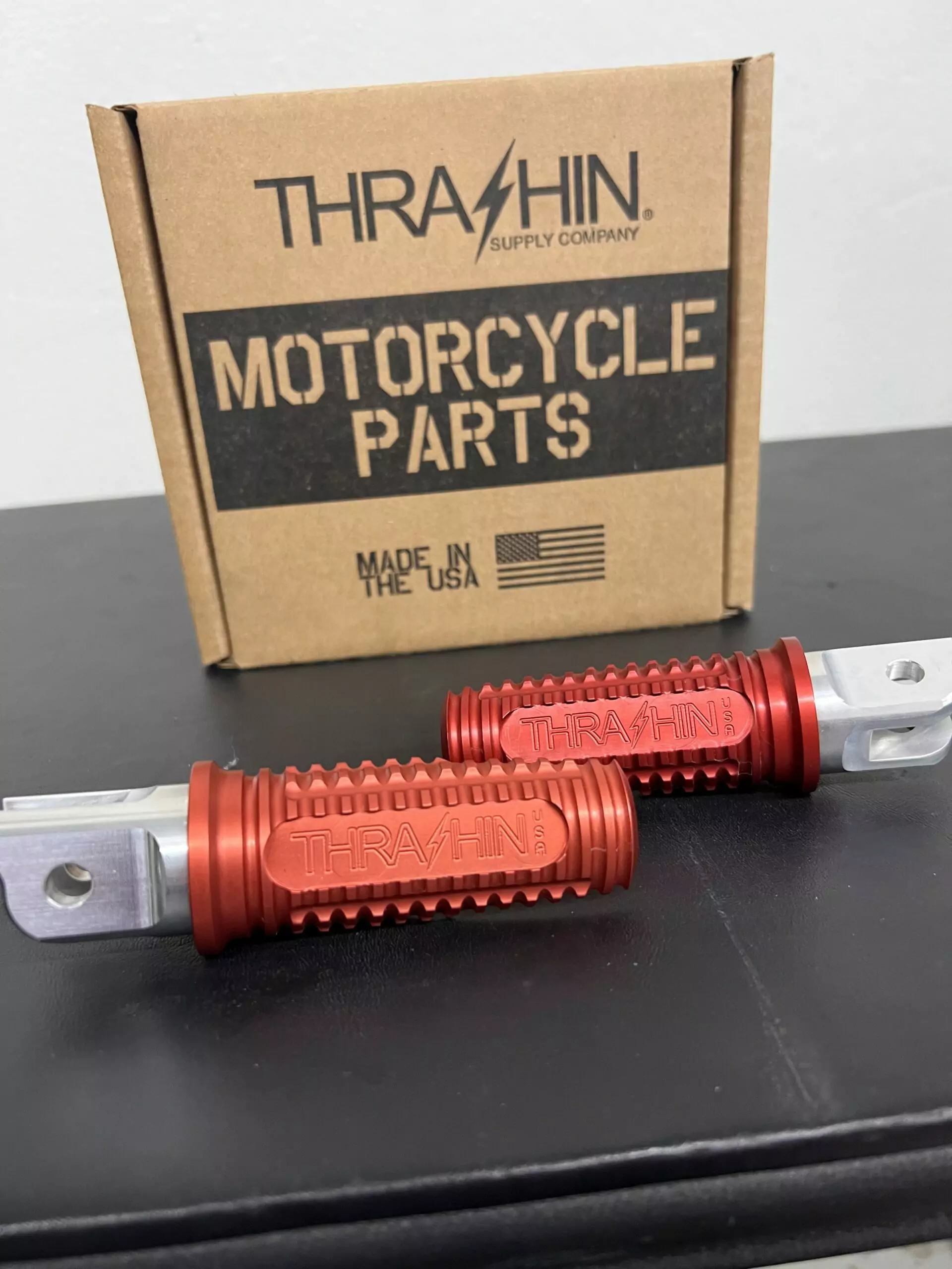 Thrashin Supply Burnout Footpegs for M8 Softail (front) in Red